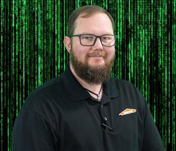 male employee posing green background