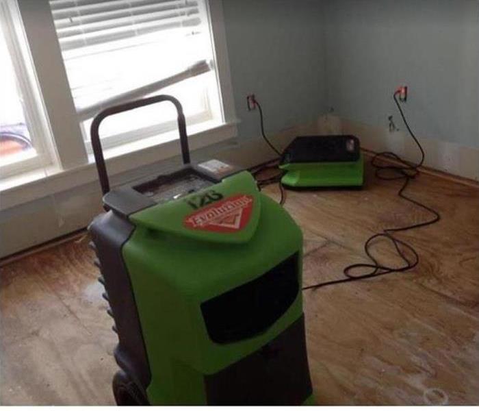 SERVPRO restoration equipment being used in water damaged room